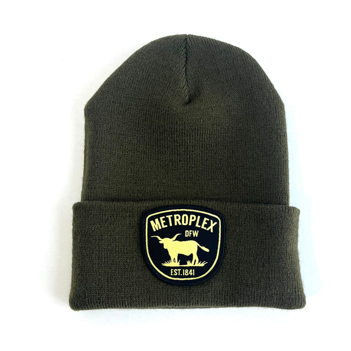 Metroplex Beanie featuring a stylish patch, perfect for showcasing your Texas pride. This olive-colored beanie is a great Texas themed gift, ideal as a souvenir from Texas or a unique Dallas souvenir. Made in Texas, it represents the spirit of Texan gifts, combining comfort and style.