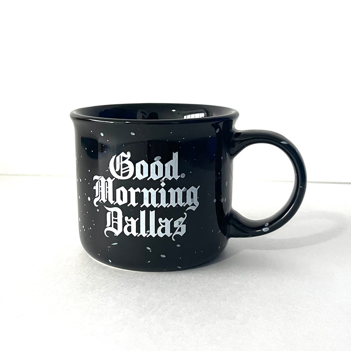 Good Morning Dallas Coffee Mug featuring a glossy black ceramic finish with speckled accents, perfect for coffee lovers. This Texas themed gift showcases a charming design, making it an ideal souvenir from Texas and a great addition to any collection of Texan gifts.