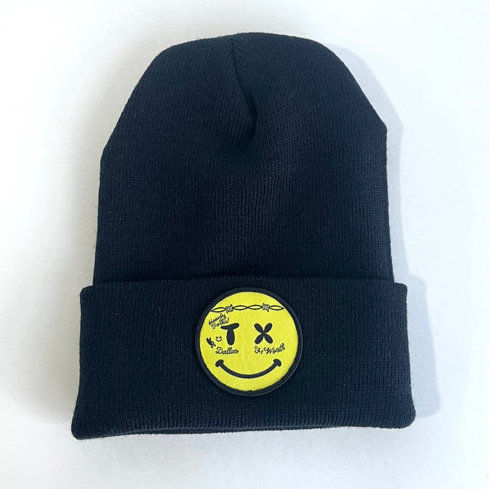 Smiley Face Beanie featuring a yellow patch on a stylish black knit cap, perfect as a Texas themed gift and a great way to show off your Texan pride with this Dallas souvenir.