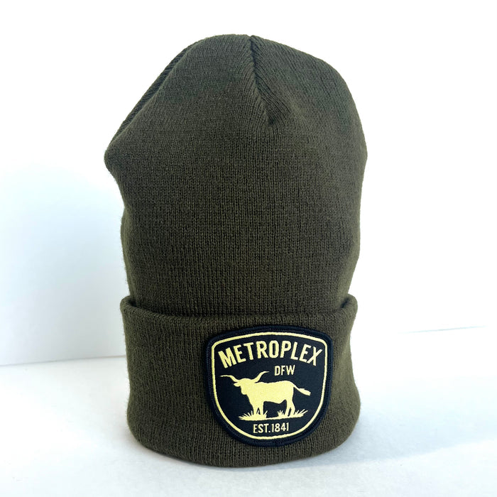 Metroplex Beanie, an olive green beanie with a handstitched patch, perfect for anyone searching for Texas themed gifts. A great souvenir from Texas, this stylish beanie is a wonderful addition to your collection of Dallas souvenirs and Texan gifts.