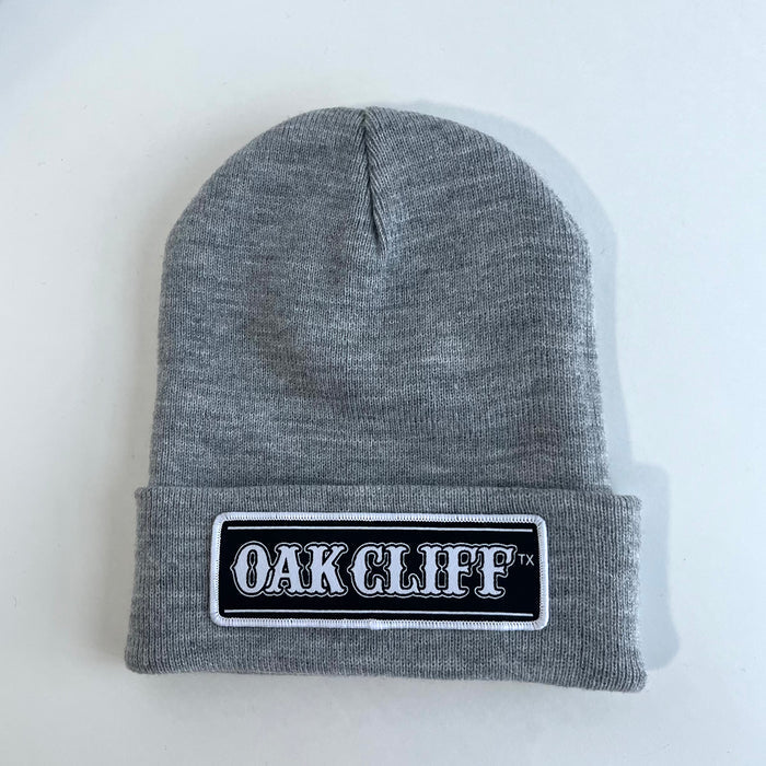 Oak Cliff Beanie, a gray beanie with a hand-stitched patch, perfect for cozy wear. A great Texas themed gift, showcasing Texas Made Gifts, ideal as souvenirs from Texas and as a Dallas souvenir for proud Texans.