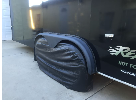 Black ADCO Double Axle Tyre Gard RV Tire Cover - Lifestyle Shot on Trailer | United RV Parts