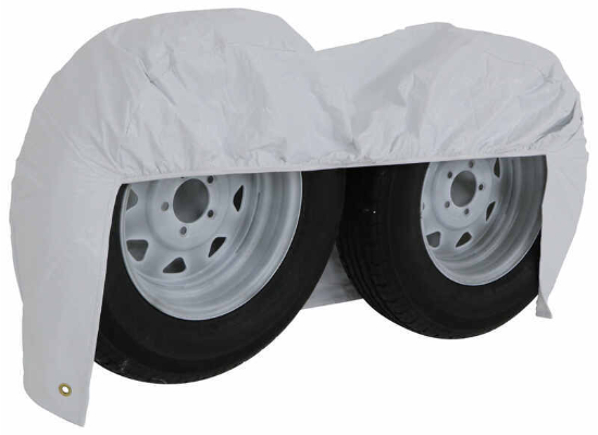 White Vinyl ADCO Double Axle Tire Cover Draping Both Wheels - Angle View | United RV Parts