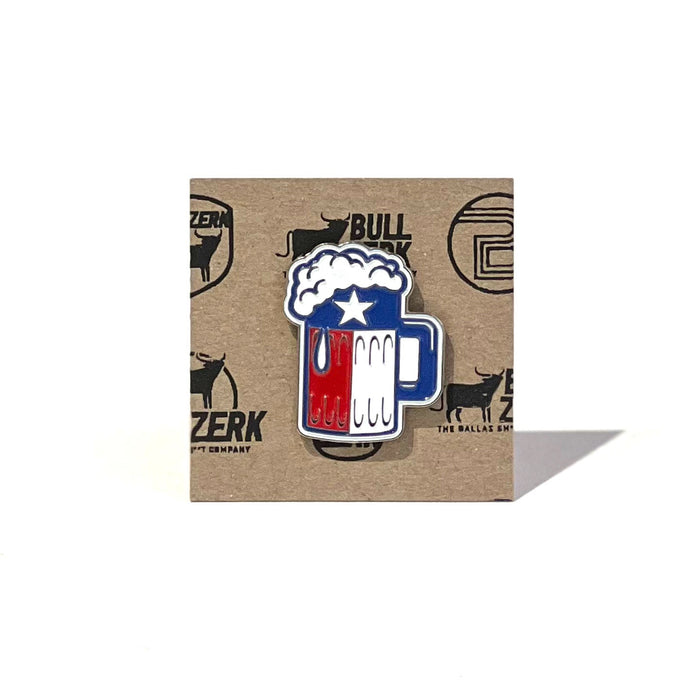 Beer Foam Enamel Pin against a rustic background, perfect for Texas themed gift enthusiasts, celebrating Texas pride. A unique Texas Made Gift, this pin serves as a memorable souvenir from Texas, ideal as a Dallas souvenir or texan gift.