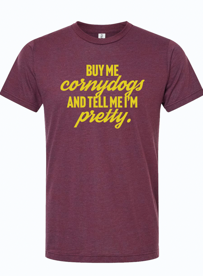 Buy me cornydogs and tell me I'm pretty T-shirt, a fun Texas themed gift perfect for anyone who loves unique souvenirs from Texas, capturing a playful Texan spirit as a great Dallas souvenir or gift.
