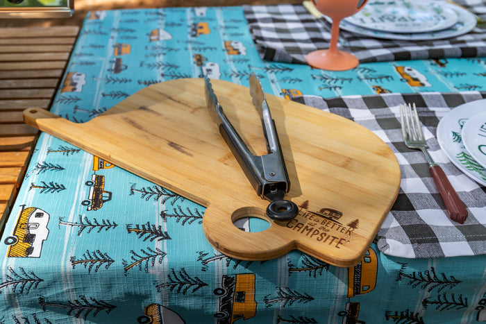 Camco 53089 Bamboo RV Cutting Board with Tongs on Campsite-Print Tablecloth - Outdoor Lifestyle | United RV Parts
