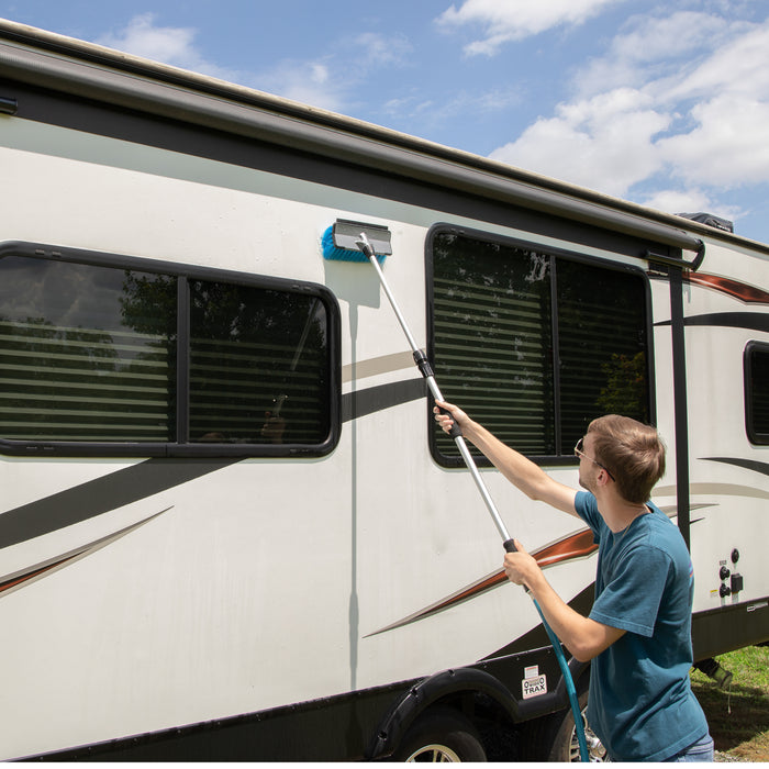 RV Owner Cleaning Motorhome with Blue Bristle Wash Brush 43633 | United RV Parts