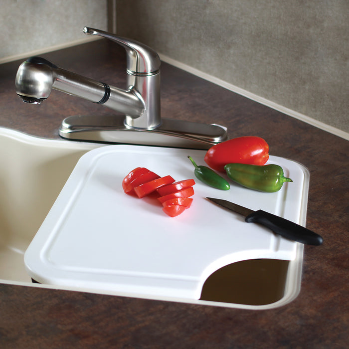 White Camco Sink Mate RV Cutting Board Over Sink - In Use with Peppers | United RV Parts