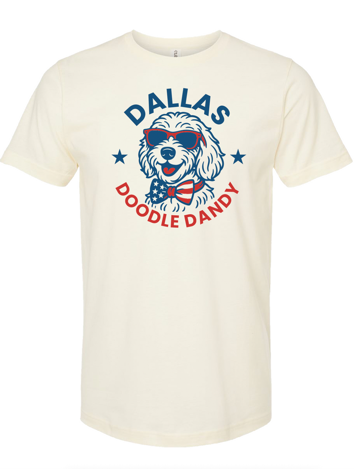 Cream tshirt with a graphic design of a doodle dog wearing sunglasses in a circle of text reading "Dallas Doodle Dandy."