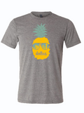 Gray t-shirt with a graphic design of a pineapple wearing sunglasses and 'dallas' text written on it.