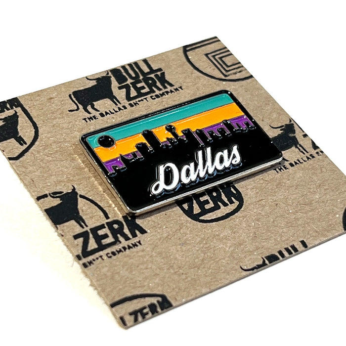 Close-up of the vibrant Dallas Skyline Enamel Pin featuring the silhouette of the city against a sunset background. An excellent choice for Texas themed gifts and Texas Made Gifts, it's a wonderful souvenir from Texas and a thoughtful option for Dallas souvenir collectors or those seeking Texan gifts.