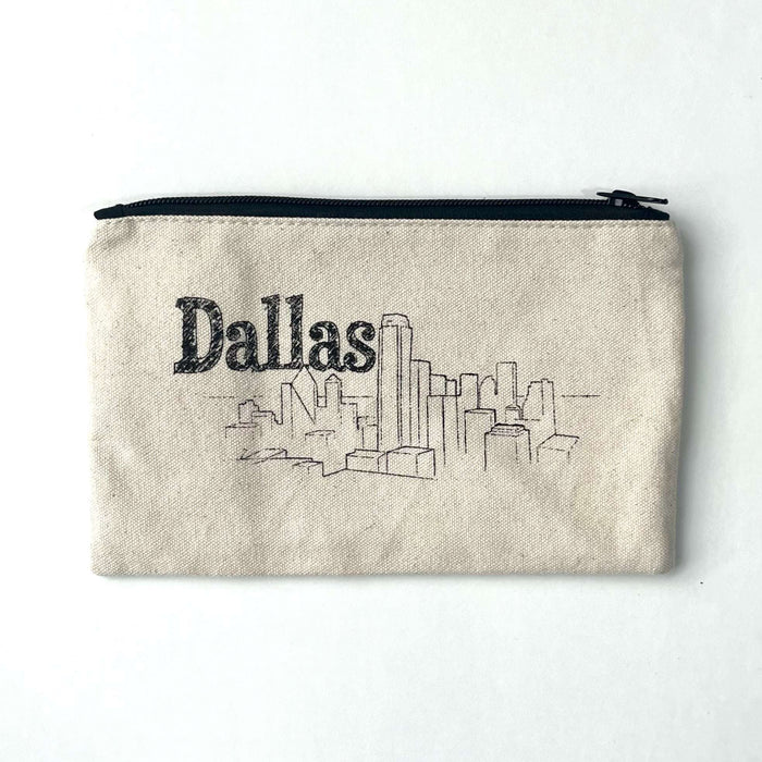 Dallas Skyline Pencil Bag featuring a simple sketch of the Dallas skyline on a natural fabric. This stylish bag is perfect for storing stationery and makes a great Texas themed gift, ideal for those looking for Texas Made Gifts or souvenirs from Texas, especially for Dallas enthusiasts.
