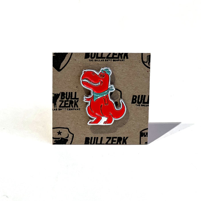 Dallasaurus Tex Enamel Pin displayed on a branded background, perfect as a Texas themed gift, a unique Texas Made Gift, and an ideal souvenir from Texas, showcasing Texas pride through this fun dallas souvenir and texan gifts.