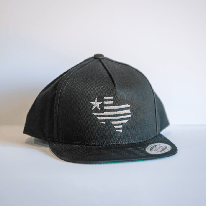 Embroidered Texas Silhouette Flatbill Hat in black, featuring a stylish design perfect for Texas themed gifts. Ideal for anyone looking for Texas made gifts or souvenirs from Texas, this hat is a great Dallas souvenir and perfect for Texan gifts.