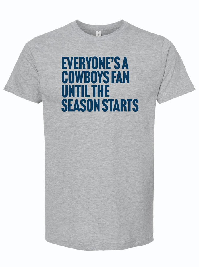 Light Gray tshirt with text reading "everyone's a cowboys fan until the season starts" in navy letters.