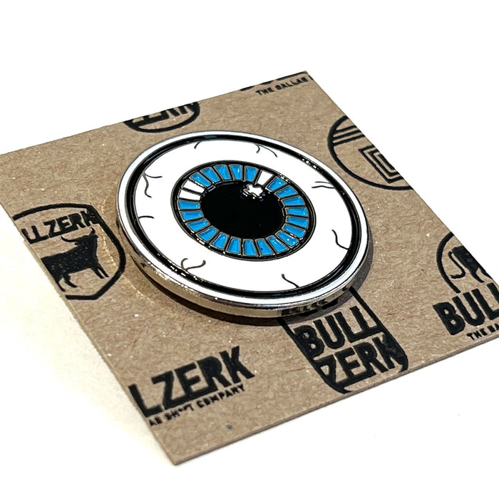 Eyeball Enamel Pin designed by Bullzerk, featuring a vibrant blue eye on a soft enamel metal pin. This unique accessory makes a perfect Texas themed gift, showcasing Texas Made Gifts, and is a fun souvenir from Texas, ideal as a Dallas souvenir or a thoughtful texan gift.