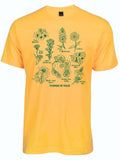 Yellow tshirt with graphic design of multiple wildflowers and text on the bottom reading "flowers of texas" all in a green ink.