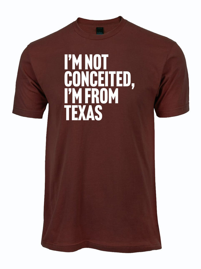A maroon shirt that reads "I'm not conceited, I'm from Texas." in white letters.