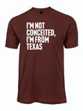A maroon shirt that reads "I'm not conceited, I'm from Texas." in white letters.
