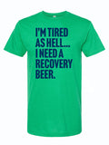 Green unisex fine jersey tee with the quote 'I’m Tired As Hell... I Need A Recovery Beer.' This shirt makes a perfect Texas themed gift, ideal for anyone looking for Texas Made Gifts, unique souvenirs from Texas, a fun Dallas souvenir, or great Texan gifts.