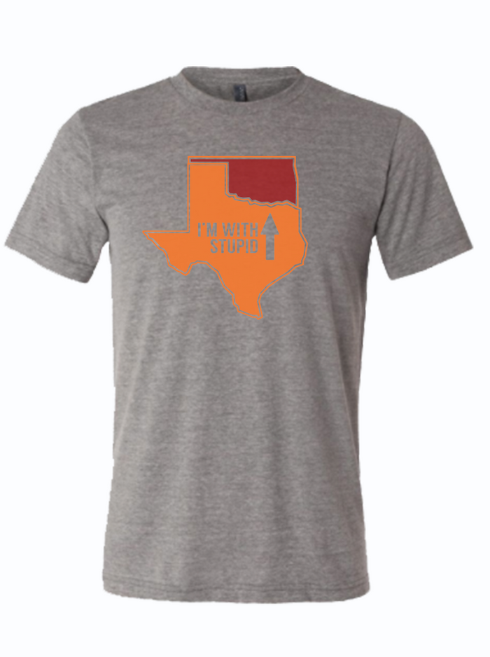 A gray shirt featuring an orange Texas that reads "I'm with stupid" and an arrow pointing to a maroon Oklahoma.