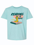 Kids t-shirt featuring the phrase 'Reading Is Dope!' with a playful bookworm design, perfect as a Texas themed gift. This stylish shirt supports local libraries, making it a unique Dallas souvenir and an excellent choice among Texas made gifts for young readers.