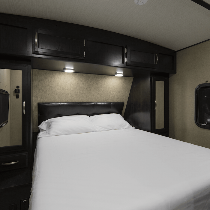 White Lippert Thomas Payne Microfiber Sheet Set on RV Queen Bed - Lifestyle View | United RV Parts