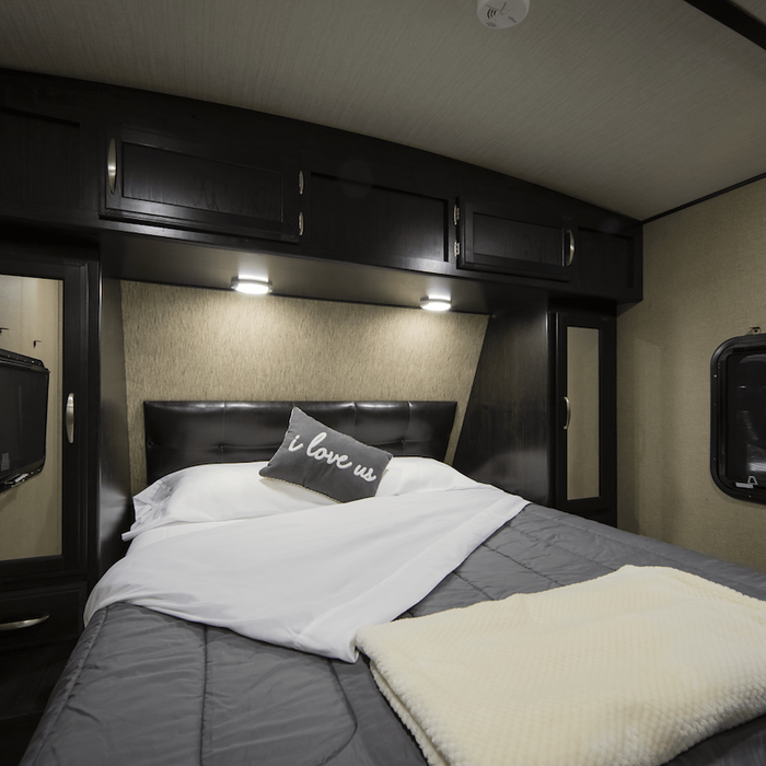 White Microfiber RV Queen Sheet Set Styled on Travel Trailer Bed - Lifestyle View | United RV Parts