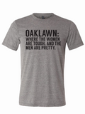 Oak Lawn: Where The Women Are Tough And The Men Are Pretty t-shirt featuring bold text on a comfortable light gray fabric. This stylish tee makes a perfect Texas themed gift, ideal as Texas Made Gifts and souvenirs from Texas, especially for those seeking a unique Dallas souvenir or Texan gifts.