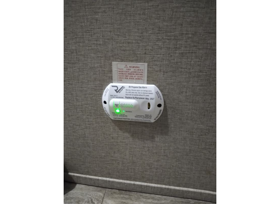 White LP Gas Alarm Installed on RV Wall - Mounted View | United RV Parts