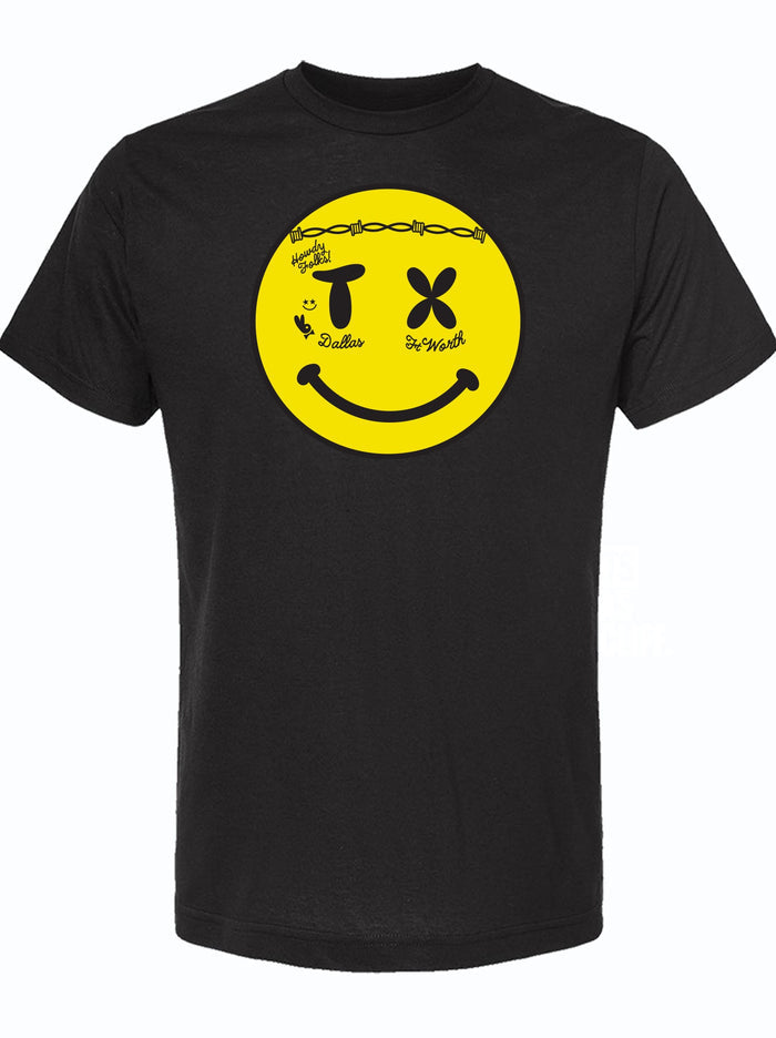 Black tshirt witha graphic design of a yellow smiley face that has face tattoos and the letters T and X as eyes.