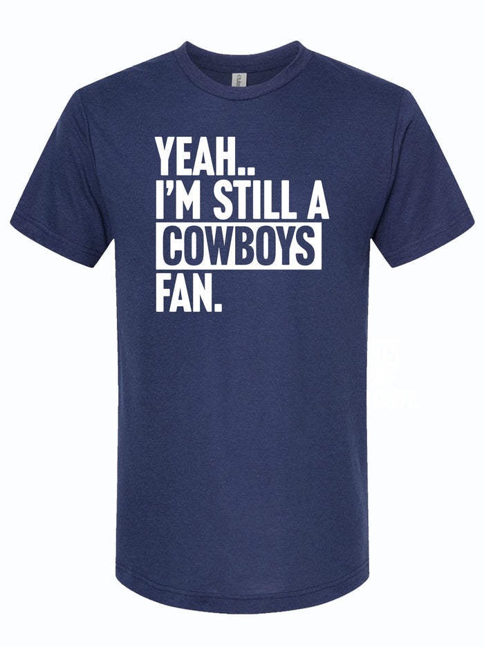 Navy tshirt with text graphic reading "Yeah.. I'm Still A Cowboys Fan" in white letters.
