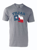 Tejas Flag T-Shirt – Heather gray unisex tee with distressed Texas flag graphic featuring a baseball-stitched Lone Star and "Tejas" arch text, screen-printed by Bullzerk