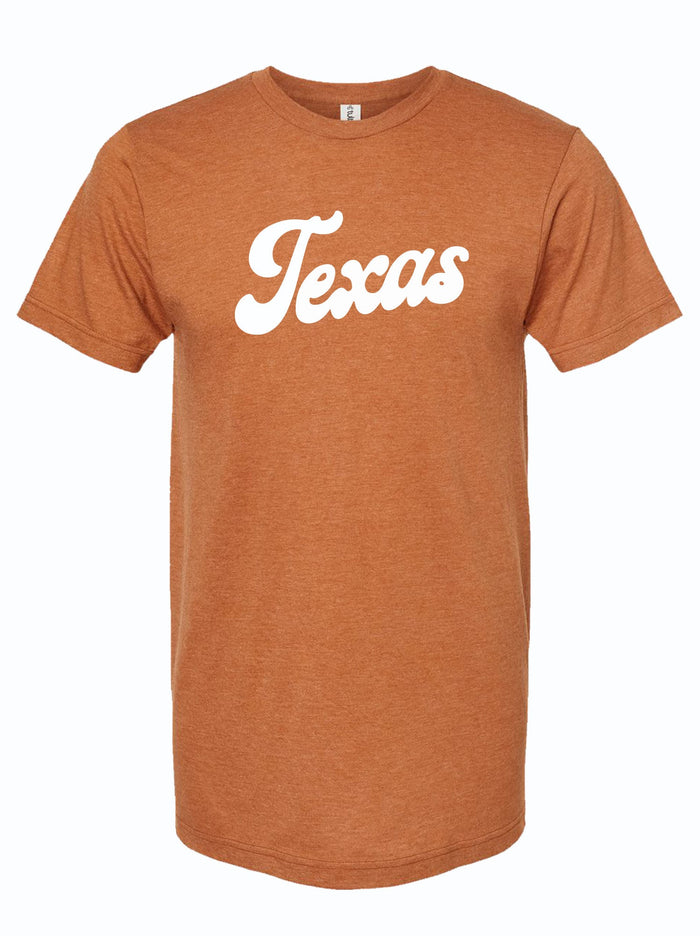 Rust orange tshirt with a graphic design of TEXAS written in a white, bubble lettered script font.