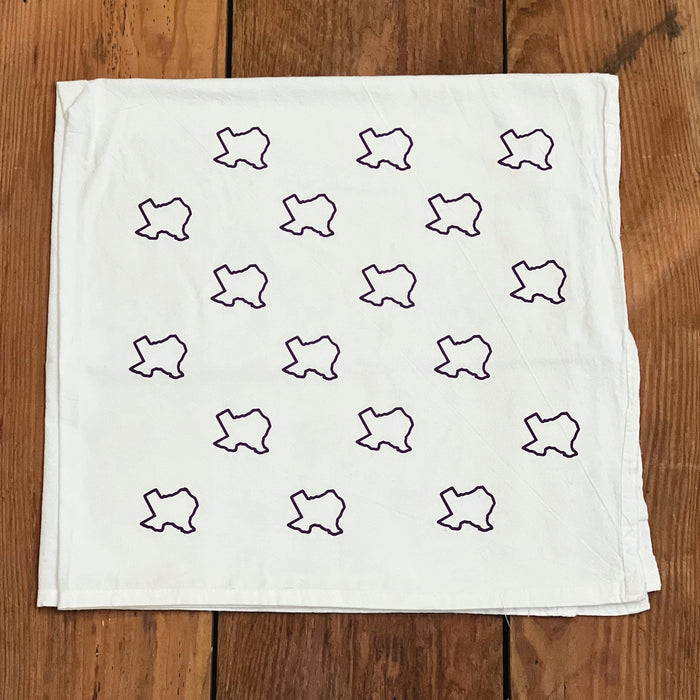 Texas Silhouette Tea Towel featuring a fun design of Texas outlines, perfect for adding a touch of southern charm to your kitchen. This kitchen accessory makes a great Texas themed gift, a Texas Made Gift, and a wonderful souvenir from Texas, ideal for anyone looking for a Dallas souvenir or unique Texan gifts.