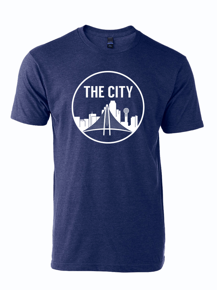 Navy tshirt with circle graphic of the Dallas Skyline and text reading "THE CITY" above it in white letters.