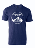 Navy tshirt with circle graphic of the Dallas Skyline and text reading "THE CITY" above it in white letters.