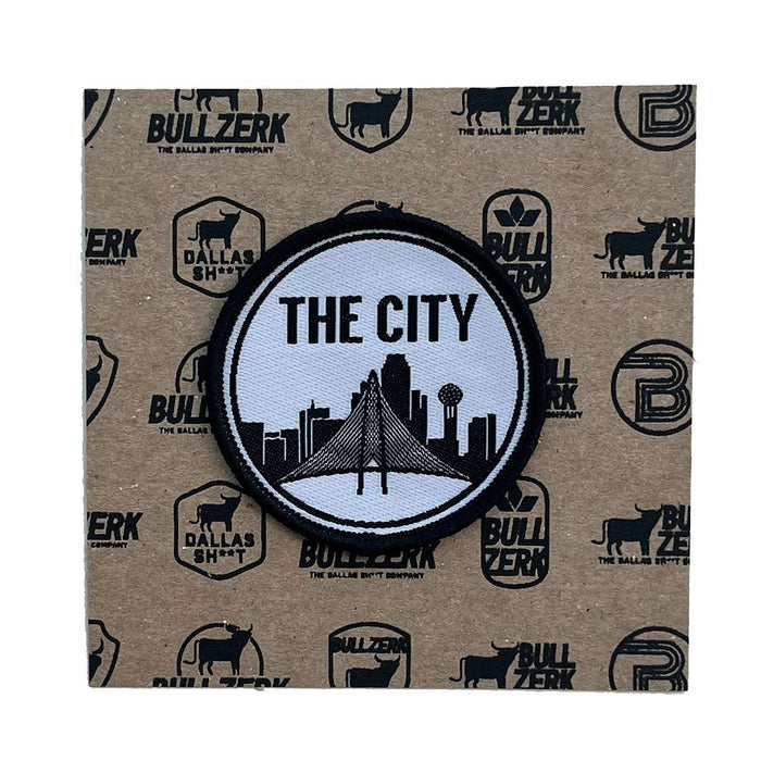 The City Patch features a stylish black and white design of a city skyline, perfect for adding flair to your jean jacket. A high-quality embroidered patch, this Texas themed gift is an ideal Texas Made Gift, serving as a unique souvenir from Texas, especially for those looking for a Dallas souvenir or Texan gifts.