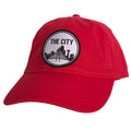 The City Patched Cotton Hat in red, adorned with an eye-catching embroidered patch, perfect for representing Texas everywhere you go. This hat serves as a fantastic Texas themed gift, a memorable choice for Texas Made Gifts, and a unique souvenir from Texas, making it a great Dallas souvenir and Texan gift.