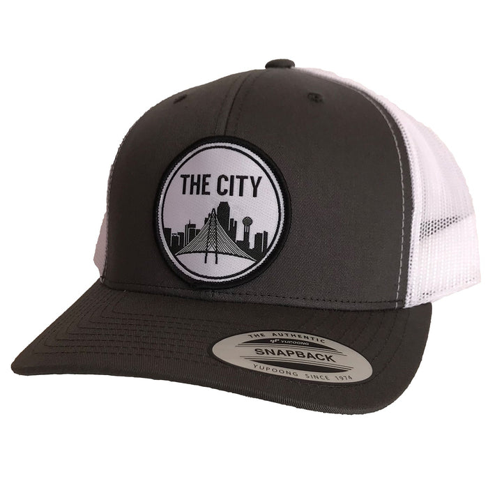 The City Patched Curved Bill Hat featuring a black and white design, perfect as a Texas themed gift or souvenir from Texas. A stylish and comfortable choice for those looking for dallas souvenirs or unique texan gifts.
