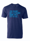 Navy tshirt with text reading "The Colony: Not a Strange Name for a City At All" in light blue letters.