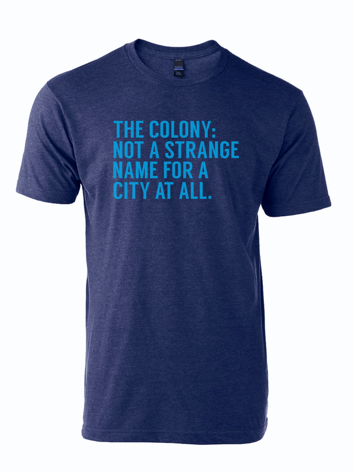 Navy tshirt with text reading "The Colony: Not a Strange Name for a City At All" in light blue letters.
