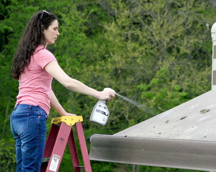 Woman Cleaning RV Awning with Thetford Spray Cleaner - In Use Action | United RV Parts