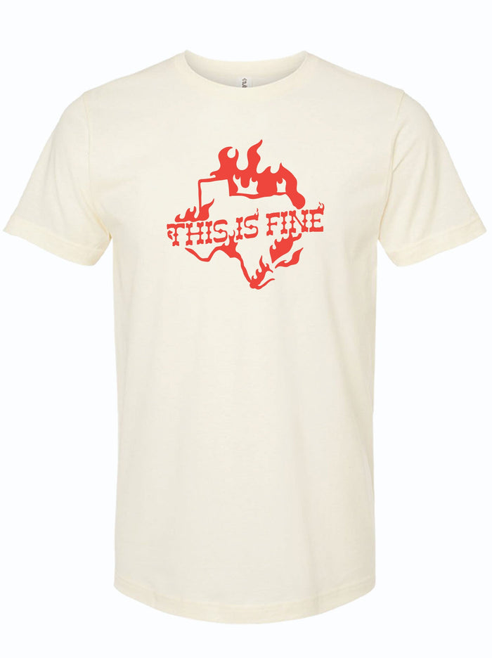 Cream tshirt with a graphic design of the shape of Texas covered in flames and text reading "This is fine" in red letters.