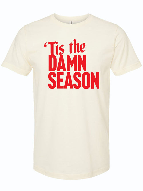'Tis the Damn Season unisex fine jersey tee shirt in cream color with bold red lettering. Perfect for anyone looking for Texas themed gift, this shirt embodies the spirit of Texas Made Gifts and makes for a great souvenir from Texas, especially as a Dallas souvenir or Texan gift.