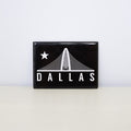 Rectangular, black magnet with Trinity design.