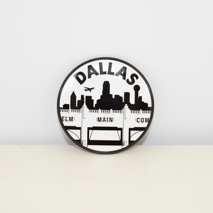 Circular, black and white magnet with Triple Underpass design.
