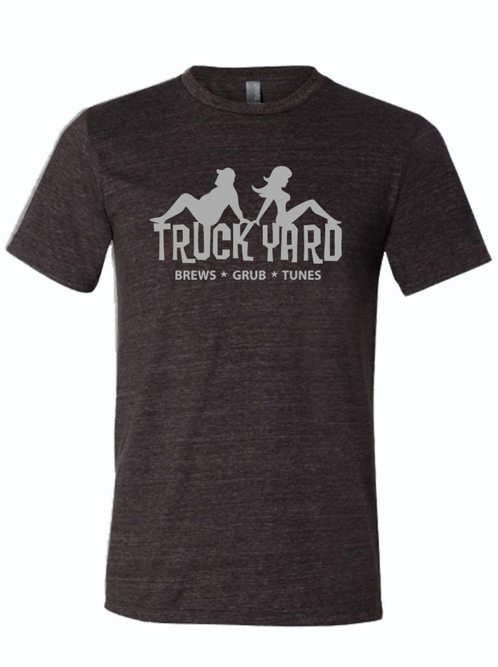 Dark, charcoal gray tshirt with graphic design of the Truck Yard logo with the silhouette of a man and a woman on top.