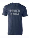 Denim blue tshirt with text reading "Truck Yard" in gray duct tape font.