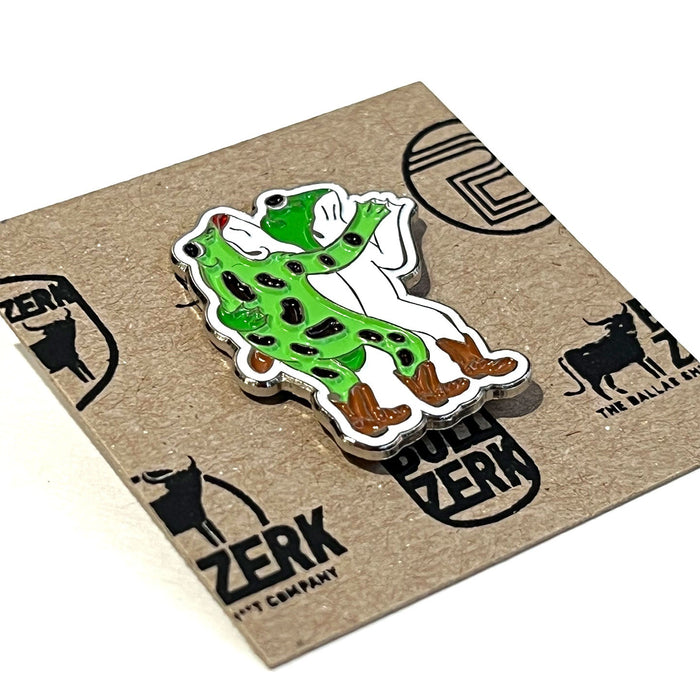 Truck Yard Frogs Enamel Pin featuring a vibrant design of two frogs in a playful pose, perfect for any Texas themed gift enthusiast. This unique piece is a great Dallas souvenir and embodies the spirit of Texas Made Gifts, making it an ideal choice for Texan gifts.